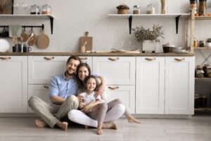 portrait of young happy family in their home