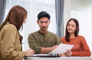 asian advisor presenting information on a tablet