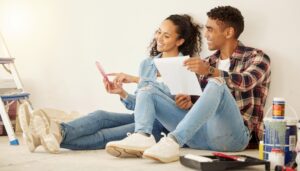 couple choosing a paint color for new room