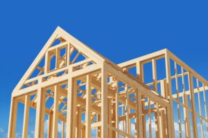 wooden house frame with blue sky in back