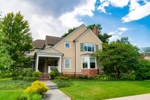 home in neighborhood with green yard and trees